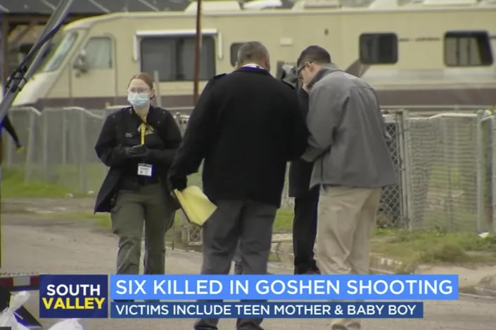 In this image from video provided by ABC30 Action News, investigators work near a home where six people were killed in Goshen, Calif., Monday, Jan. 16, 2023. Authorities are searching for at least two suspects who shot and killed six people including a 17-year-old mother and her 6-month-old baby in what the local sheriff called a "horrific massacre" related to drugs and gangs. (ABC30 Action News)