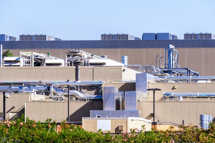 Warehouse building with external fans and pipes