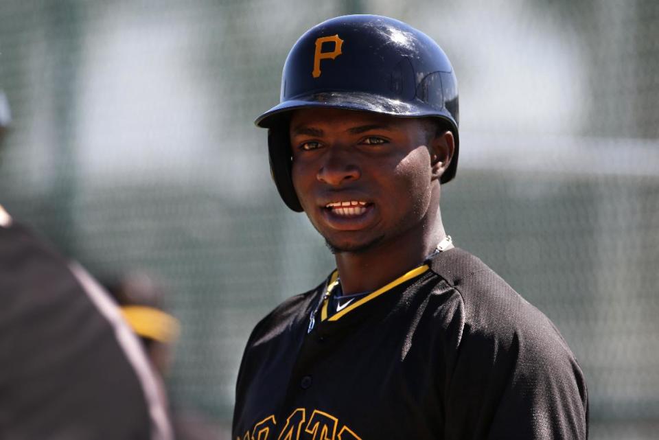 Pittsburgh Pirates' Gregory Polanco waits his turn to hit against live pitching during the team's baseball spring training workout in Bradenton, Fla., Thursday, Feb. 20, 2014. (AP Photo/Gene J. Puskar)