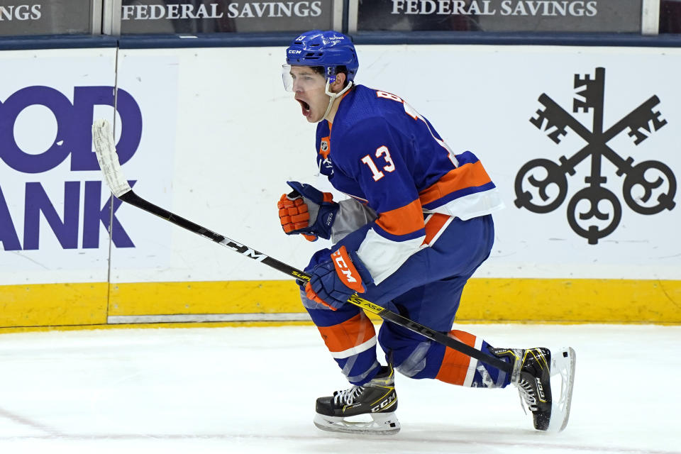 New York Islanders center Mathew Barzal (13) reacts after scoring a goal against Pittsburgh Penguins goalie Caey DeSmith during the third period of an NHL hockey game, Thursday, Feb. 11, 2021, in Uniondale, N.Y. (AP Photo/Kathy Willens)