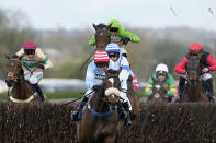 Jockey Stan Sheppard riding Cruz Control leads on their way to win the William Hill Handicap Chase race on the third day of the Grand National Horse Racing meeting at Aintree racecourse, near Liverpool, England, Saturday, April 13, 2024. Organizers of Britain's biggest horse race have taken action to improve safety and avoid a repeat of the chaos sparked by animal-rights activists before last year's edition.(AP Photo/Dave Shopland)