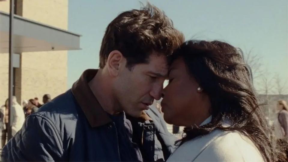 origin, jon bernthal and aunjanue ellis, a white man and black woman, outdoors with their foreheads touching