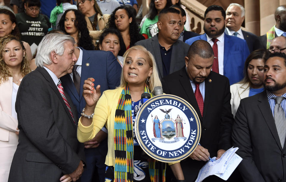 New York Assemblywoman Maritza Davila, center, urges state senators to pass the Green Light Bill granting undocumented immigrants access to driver's licenses, during a June 17 rally in Albany, N.Y. Despite hesitation from some Democrats, the bill passed and was signed the next day. (Photo: (AP Photo/Hans Pennink))