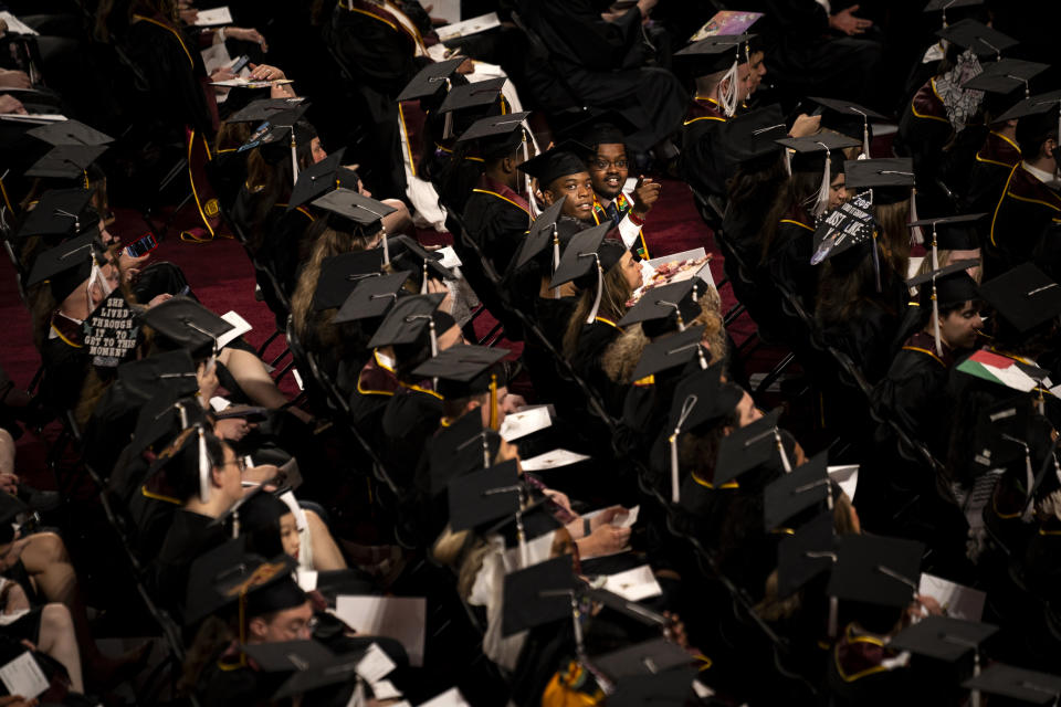 University of Minnesota students attend the College of Liberal Arts graduation ceremony in Minneapolis, Sunday, May 12, 2024. (Angelina Katsanis/Star Tribune via AP)