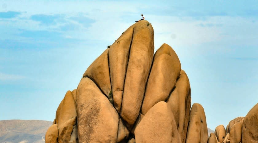 A climber rests in the Jumbo Rocks area of Joshua Tree National Park in March, 2019.