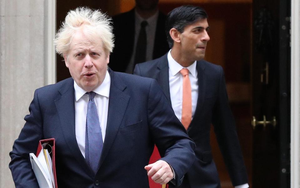 Boris Johnson and Rishi Sunak face a seismic decision around whether to proceed with plans to raise National Insurance in April - Jonathan Brady/PA Wire