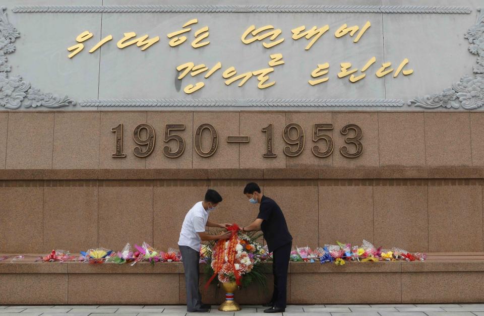 People visit the Victorious Fatherland Liberation War Museum to lay flowers on the occasion of the 67th anniversary of the end of the Korean War, which the country celebrates as the day of "victory in the fatherland liberation war" in Pyongyang, Monday, July 27, 2020. (AP Photo/Jon Chol Jin)