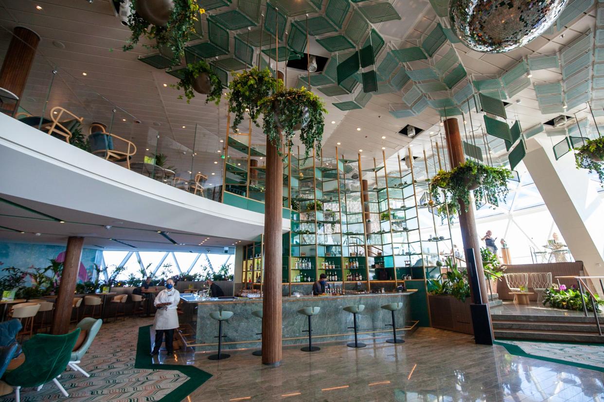hanging plants and green decor around the multi-floor Eden venue