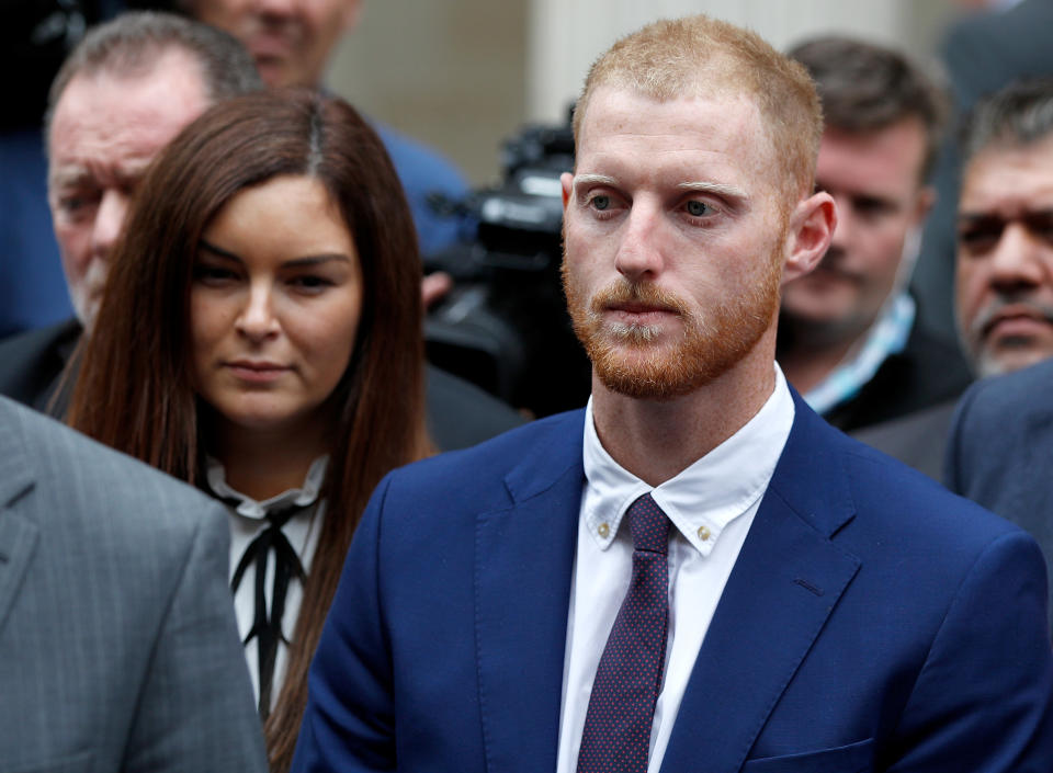 England cricket player Ben Stokes listens as his lawyer reads a statement outside Bristol Crown Court after he was acquitted of affray in Bristol, Britain, August 14, 2018. REUTERS/Peter Nicholls