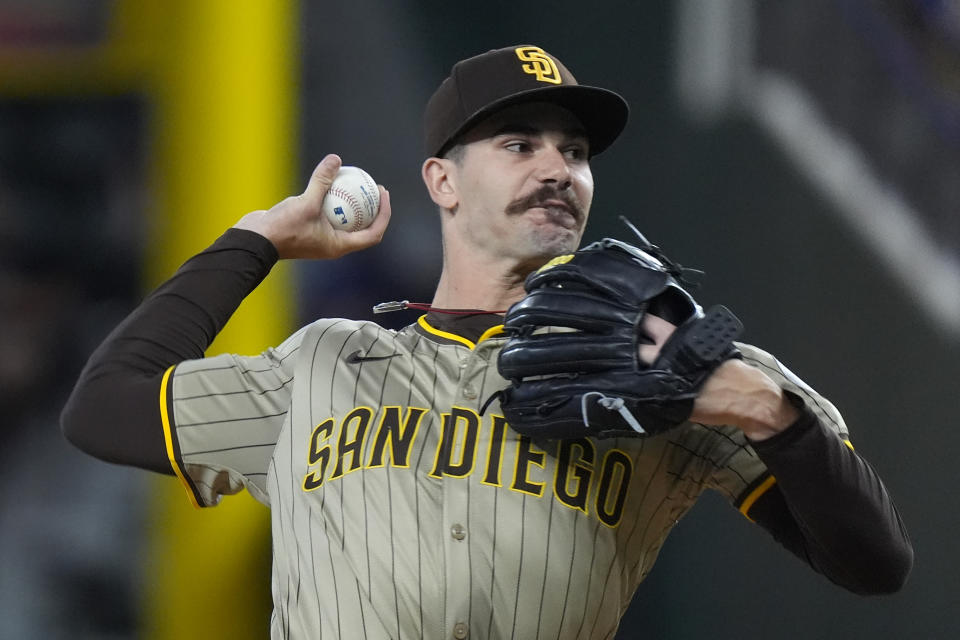 San Diego Padres starting pitcher Dylan Cease throws during the first inning of a baseball game against the Texas Rangers in Arlington, Texas, Tuesday, July 2, 2024. (AP Photo/LM Otero)