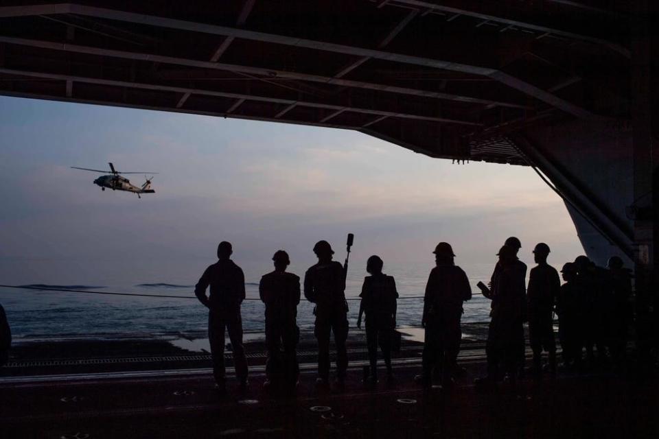 US Navy sailors prepare for a replenishment-at-sea aboard USS Dwight D. Eisenhower in the Arabian Gulf.