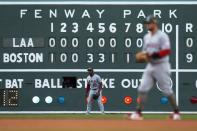 Los Angeles Angels' Justin Upton (10) and David Fletcher play against the Boston Red Sox during the eighth inning of a baseball game, Saturday, May 15, 2021, in Boston. (AP Photo/Michael Dwyer)