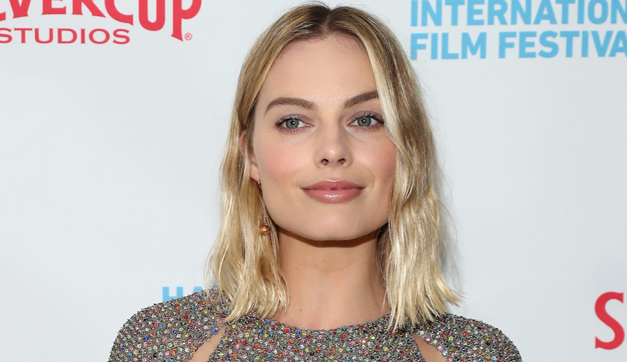 Margot Robbie looks like a rainbow disco ball in her sparkling mini dress