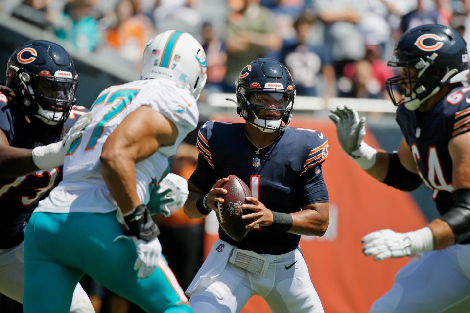 Chicago Bears quarterback Justin Fields looks to pass against the Miami Dolphins during a preseason game at Soldier Field, Aug. 14, 2021 in Chicago.