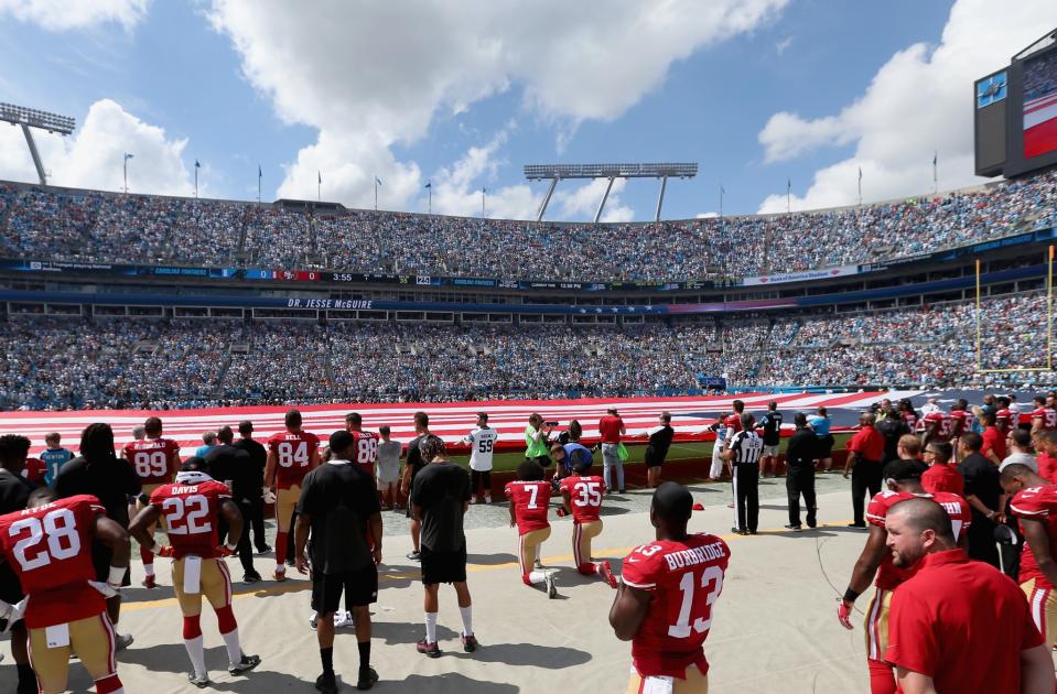<p>Colin Kaepernick #7 and teammate Eric Reid #35 of the San Francisco 49ers kneel during the national anthem before their game against the Carolina Panthers at Bank of America Stadium on September 18, 2016 in Charlotte, North Carolina. (Photo by Streeter Lecka/Getty Images) </p>