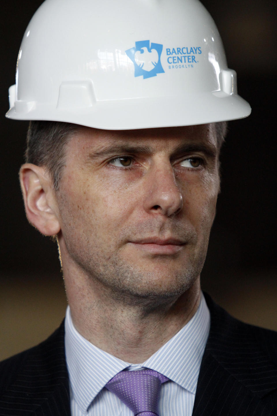 Mikhail Prokhorov, Russian billionaire and owner of the New Jersey Nets basketball team, listens during a news conference at the Barclays Center arena on Tuesday, April 10, 2012 in the Brooklyn borough of New York. Prokhorov surveyed the ongoing construction for the Nets new home and said he's "very committed" to bringing an NBA title to Brooklyn. (AP Photo/Bebeto Matthews)