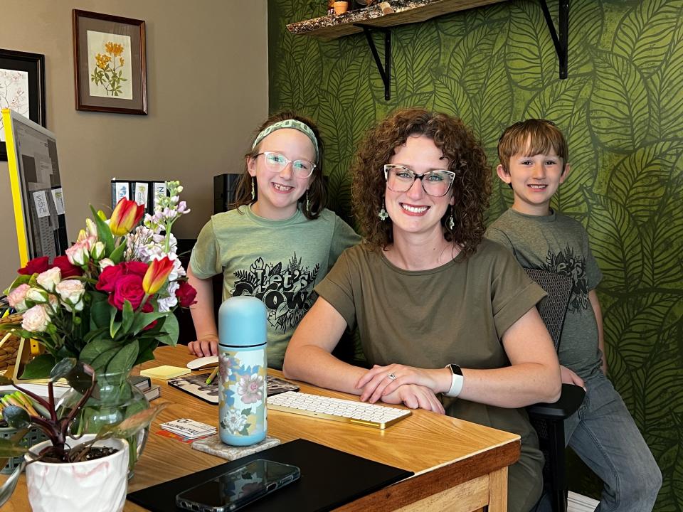 Cultivate Creative owner Angela Eldridge recently moved her graphic design business to a new downtown office at 125 W. Wheeling St. She's shown here with daughter, Azalea and son, Leo.