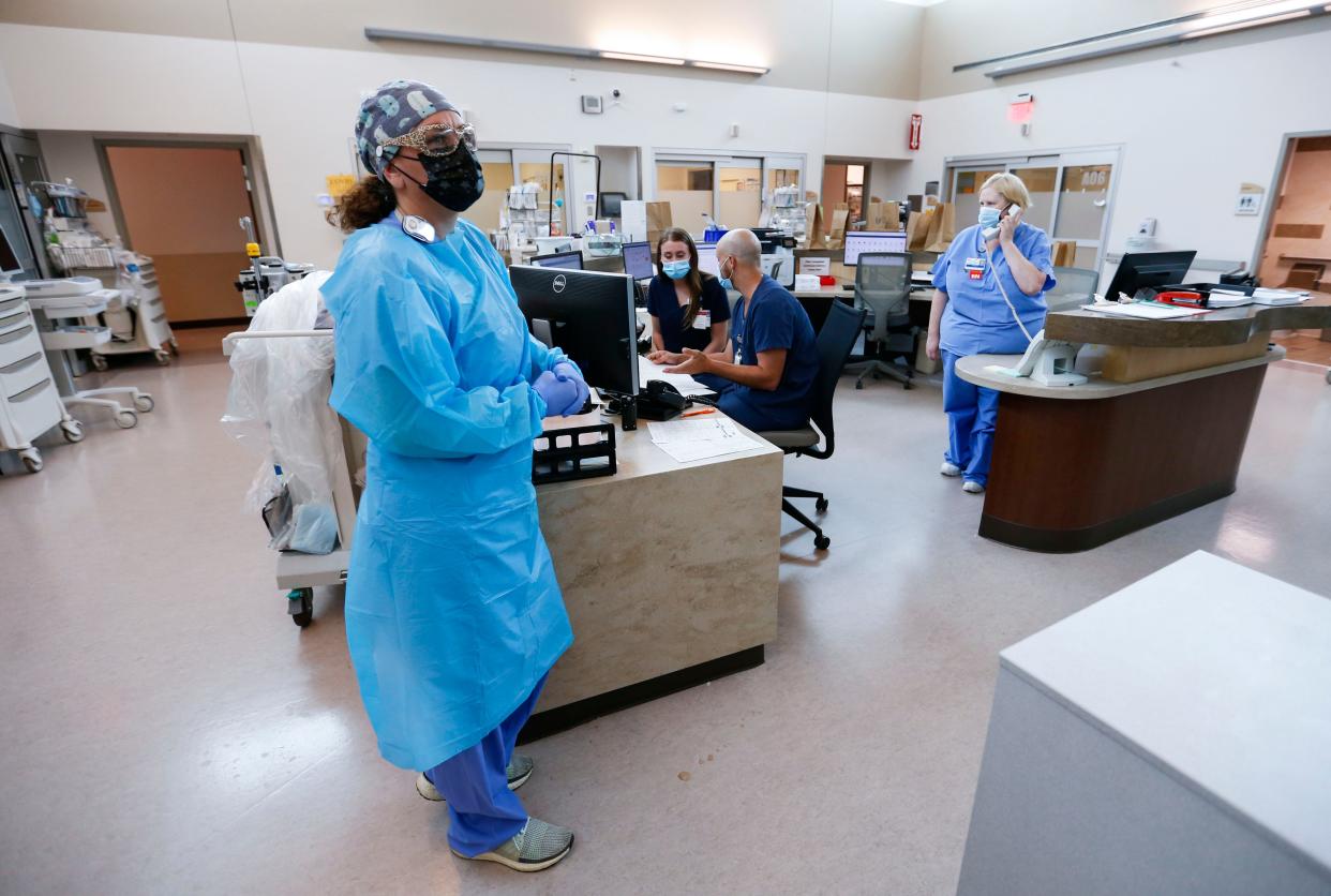 Nurses and doctors in the CoxHealth Emergency Department in Springfield don personal protective equipment to treat patients with COVID-19 on Friday, July 16, 2021.