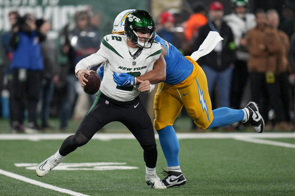 Los Angeles Chargers linebacker Tuli Tuipulotu (45) sacks New York Jets quarterback Zach Wilson (2) during the fourth quarter of an NFL football game, Monday, Nov. 6, 2023, in East Rutherford, N.J. (AP Photo/Seth Wenig)