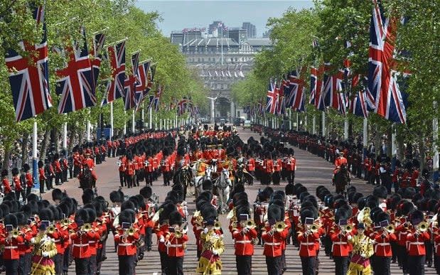 Military bands and Foot Guards march along The Mall during the Trooping the Colour ceremony - Credit: Reuters
