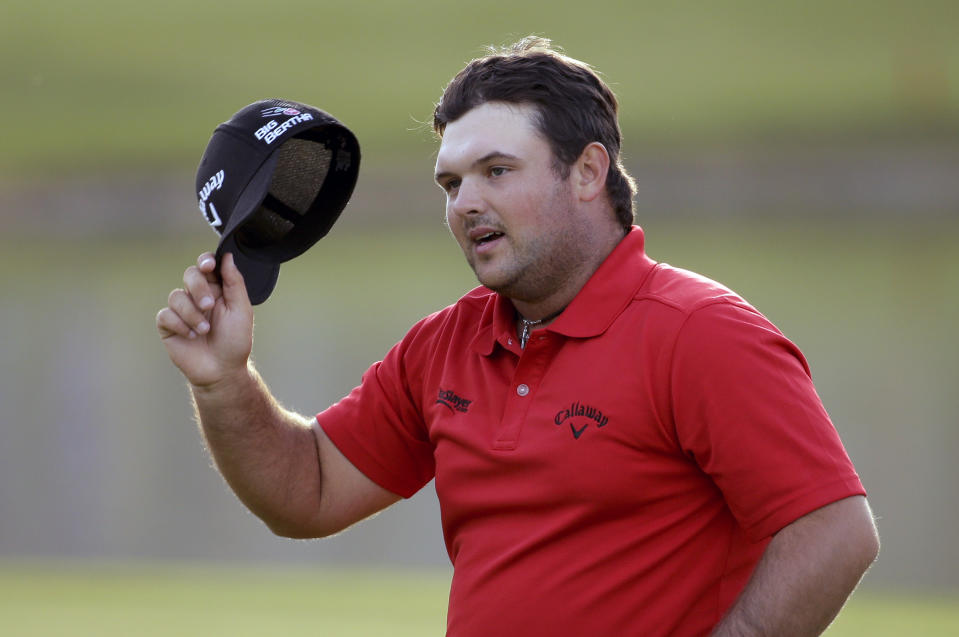 Patrick Reed waves after winning the Humana Challenge golf tournament on the Palmer Private course at PGA West, Sunday, Jan. 19, 2014 in La Quinta, Calif. (AP Photo/Chris Carlson)