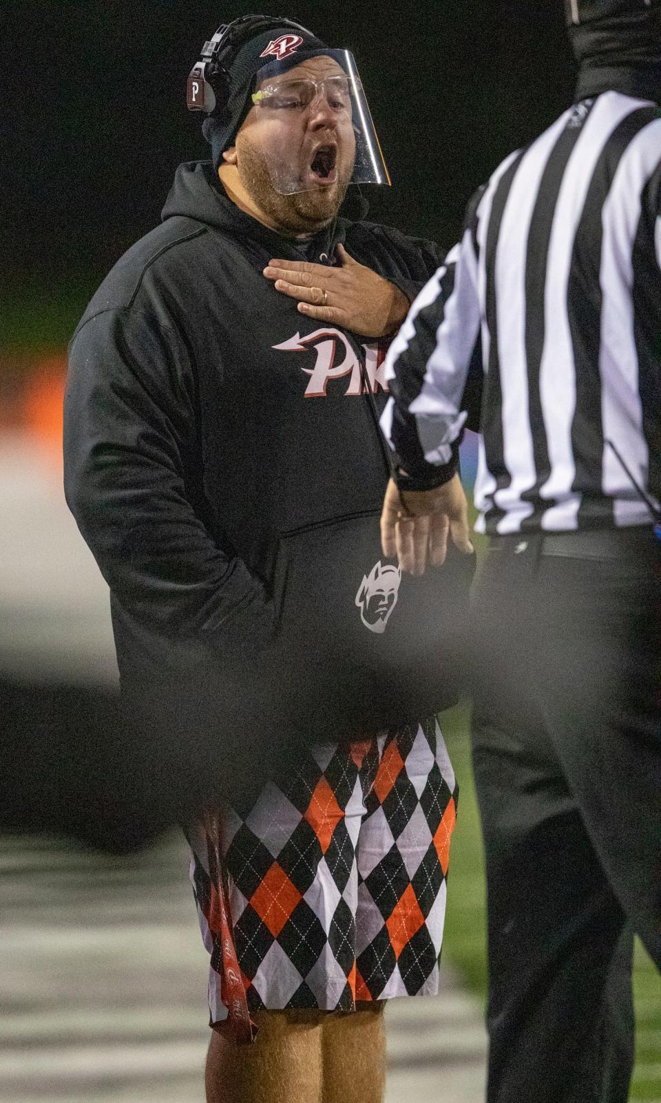 Patrick Echeverria, head coach of Pike High School, with his signature shorts, Pike vs. Carmel High School football, Carmel, Friday, Oct. 30, 2020. Game one of playoffs. 