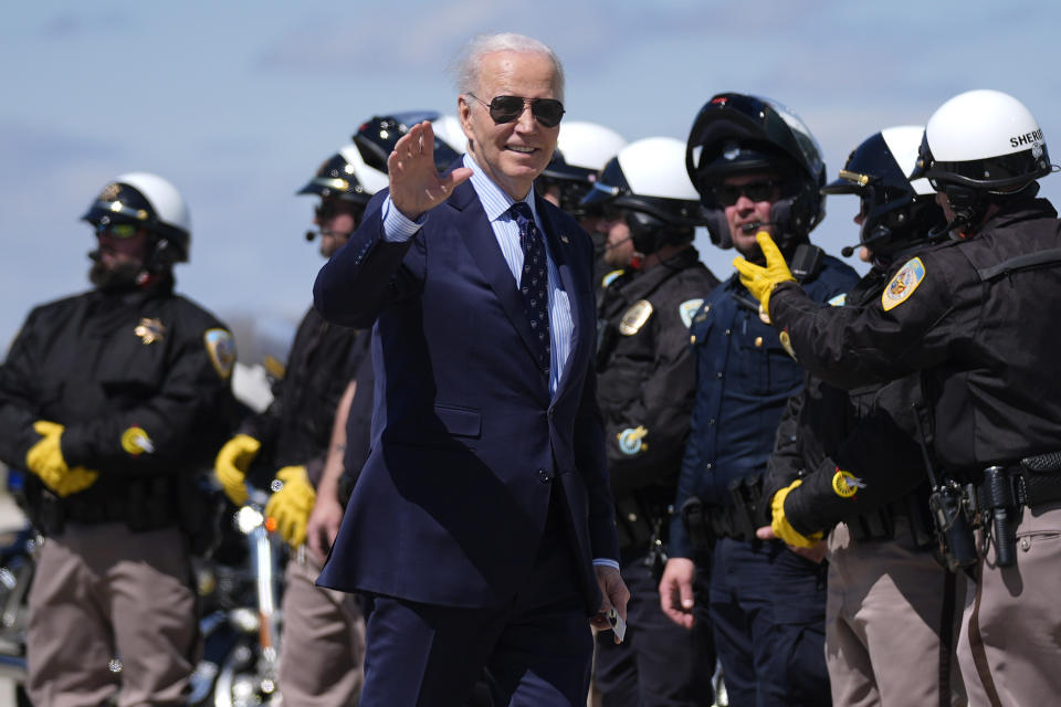 President Joe Biden waves as he walk to Air Force One in Dane County Regional Airport Monday, April 8, 2024, in Madison, Wis., en route to Chicago. (AP Photo/Evan Vucci)