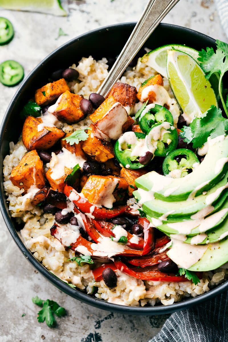 <p>Going meatless just got way more delicious.</p><p>Get the recipe from <a href="http://www.chelseasmessyapron.com/easy-sweet-potato-black-bean-burrito-bowls/" rel="nofollow noopener" target="_blank" data-ylk="slk:Chelsea's Messy Apron;elm:context_link;itc:0;sec:content-canvas" class="link ">Chelsea's Messy Apron</a>.</p>