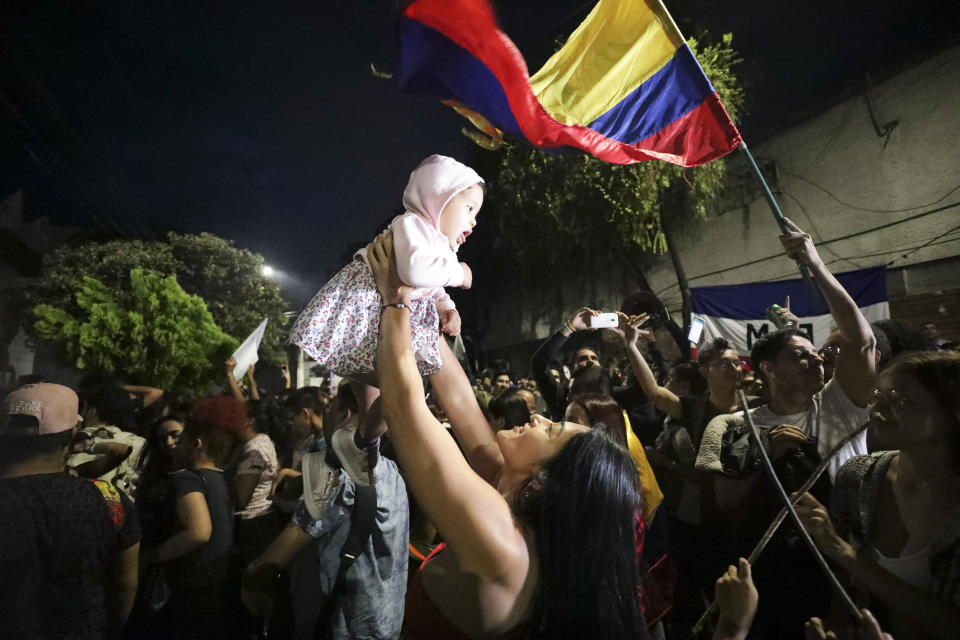 Supporters of former rebel Gustavo Petro celebrate after he won a runoff election in Bucaramanga, Colombia, Sunday, June 19, 2022. (AP Photo/Ivan Valencia)