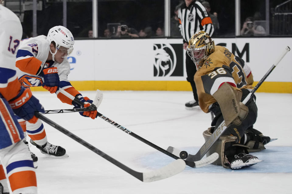 Vegas Golden Knights goaltender Logan Thompson (36) blocks a shot by New York Islanders left wing Anders Lee (27) during the first period of an NHL hockey game Saturday, Jan. 6, 2024, in Las Vegas. (AP Photo/John Locher)