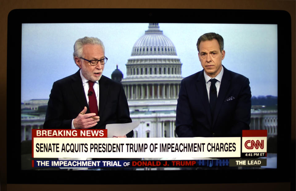 FEBRUARY 5, 2020: A television screen shot during live CNN coverage of the President Donald Trump impeachment trial on February 5, 2020, shows CNN news anchors Wolf Blitzer and Jake Tapper moments after the final vote in the U.S. Senate which acquitted Trump of two articles of impeachment. (Photo by Robert Alexander/Getty Images)