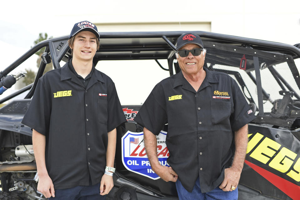 This March 9, 2019, photo provided by Auto Imagery shows former drag racer Don Prudhomme, left, and Jagger Jones at the Snake Racing Performance Shop in Vista, Calif. Prudhomme swore he would never enter the Mexican 1000 again after struggling to get through the difficult off-road race in Baja California. A year later, The Snake is tackling it again, this time with 16-year-old Jagger Jones at his side.(Richard Shute/Auto Imagery via AP)