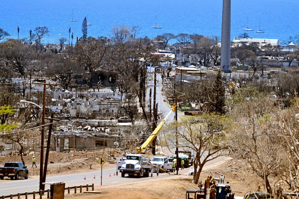 Power crews work to replace power poles and lines in Lahaina, Hawaii, on Thursday, Aug. 17, 2023. Response to the Maui fire that destroyed a large portion of the town continues to come in from neighboring islands and the mainland. | Scott G Winterton, Deseret News