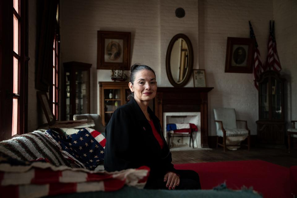Claudia Alcazar, 54, county chair for Starr County Republican Party, sits in a second-story living room of the Crisoforo Solis House and Drug Store, a historic building built in 1900 located on Highway 83, in Rio Grande City, Texas, on Oct. 6.