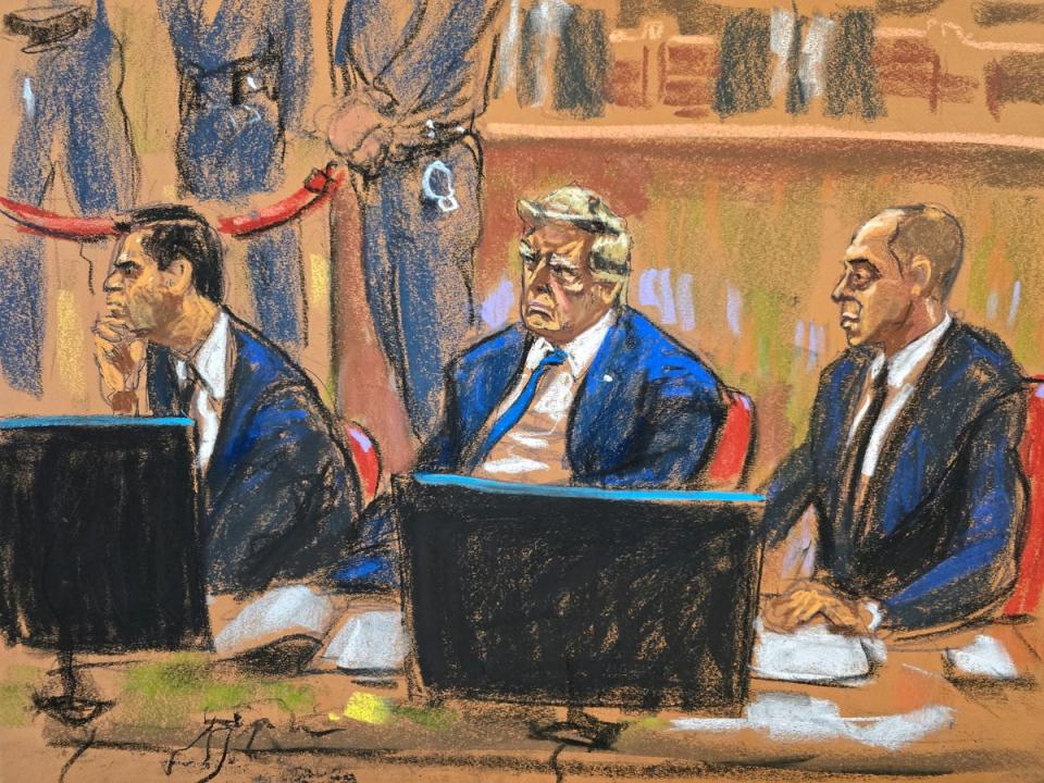 Donald Trump sits beside his lawyers Todd Blanche and Emil Bove during jury selection on Thursday (Reuters)