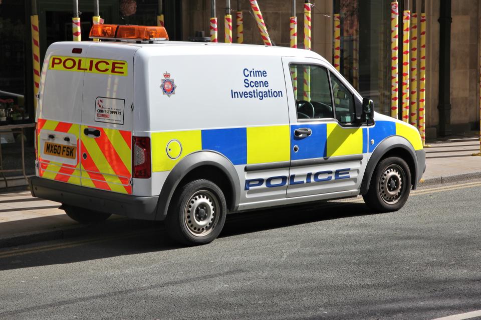 British Police Crime Scene Investigation vehicle parked in Manchester, UK. The car is Ford Tourneo.