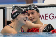 Kathleen Ledecky, of United States, celebrates after winning the gold medal in the women's 800-meter freestyle final at the 2020 Summer Olympics, Saturday, July 31, 2021, in Tokyo, Japan. (AP Photo/Jae C. Hong)