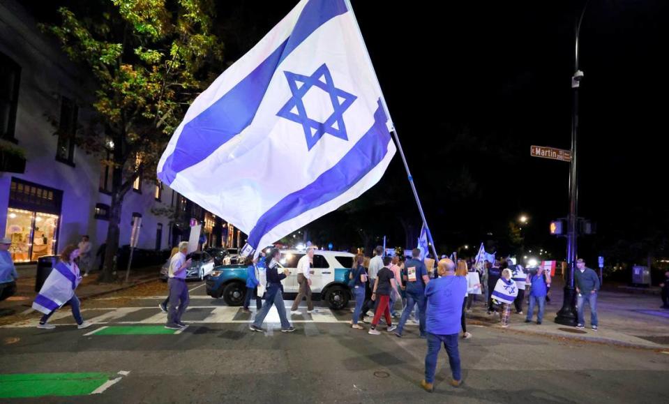 Over a hundred people marched in downtown Raleigh, N.C., on Tuesday evening, Nov. 7, 2023, calling for the release of hostages taken by Hamas when they attacked Israel in October.