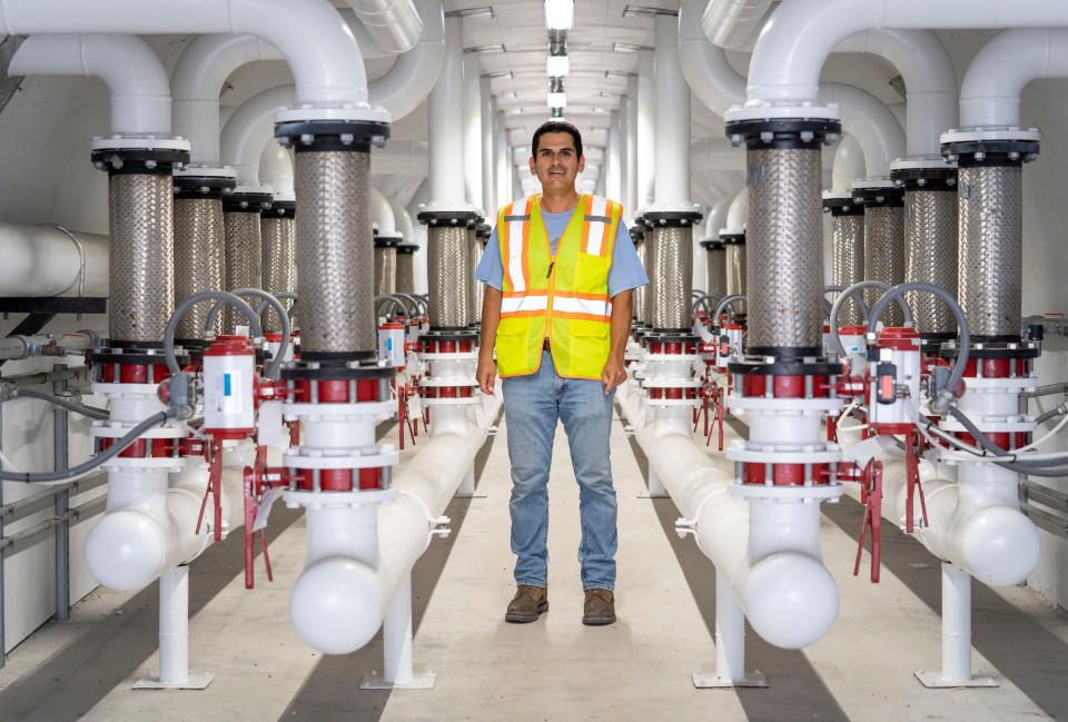 Terminal manager Arnoldo Lara stands in the tunnel of the Ozinga cement terminal at the Port of Palm Beach in Riviera Beach, Florida on August 3, 2023. The facility receives and stores international shipments of cement that are transported to other locations for use in the production of ready-mix concrete.