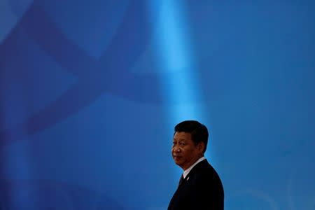 FILE PHOTO: Chinese President Xi Jinping waits for leaders to arrive before the opening ceremony in the Expo Center at the fourth Conference on Interaction and Confidence Building Measures in Asia (CICA) summit in Shanghai May 21, 2014. REUTERS/Aly Song/File Photo