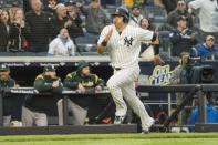 May 12, 2018; Bronx, NY, USA; New York Yankees catcher Gary Sanchez (24) scores the game winning run during the eleventh inning against the Oakland Athletics at Yankee Stadium. Mandatory Credit: Gregory J. Fisher-USA TODAY Sports