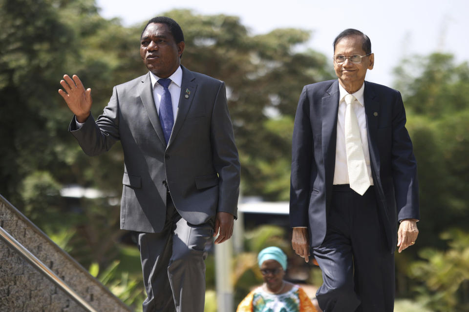 President of Zambia Hakainde Hichilema, left, arrives for the Leaders' Retreat on the sidelines of the Commonwealth Heads of Government Meeting at Intare Conference Arena in Kigali, Rwanda, Saturday, June 25, 2022. (Dan Kitwood/Pool Photo via AP)