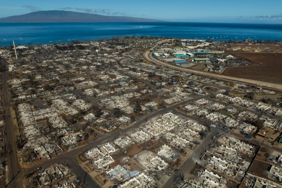 FILE – The aftermath of a wildfire is visible in Lahaina, Hawaii, Aug. 17, 2023. The nonprofit Entertainment Industry Foundation says the People’s Fund of Maui, which was started by Oprah Winfrey and Dwayne Johnson to benefit survivors of the wildfires last summer, has given away almost $60 million over six months to 8,100 adults. (AP Photo/Jae C. Hong, File)