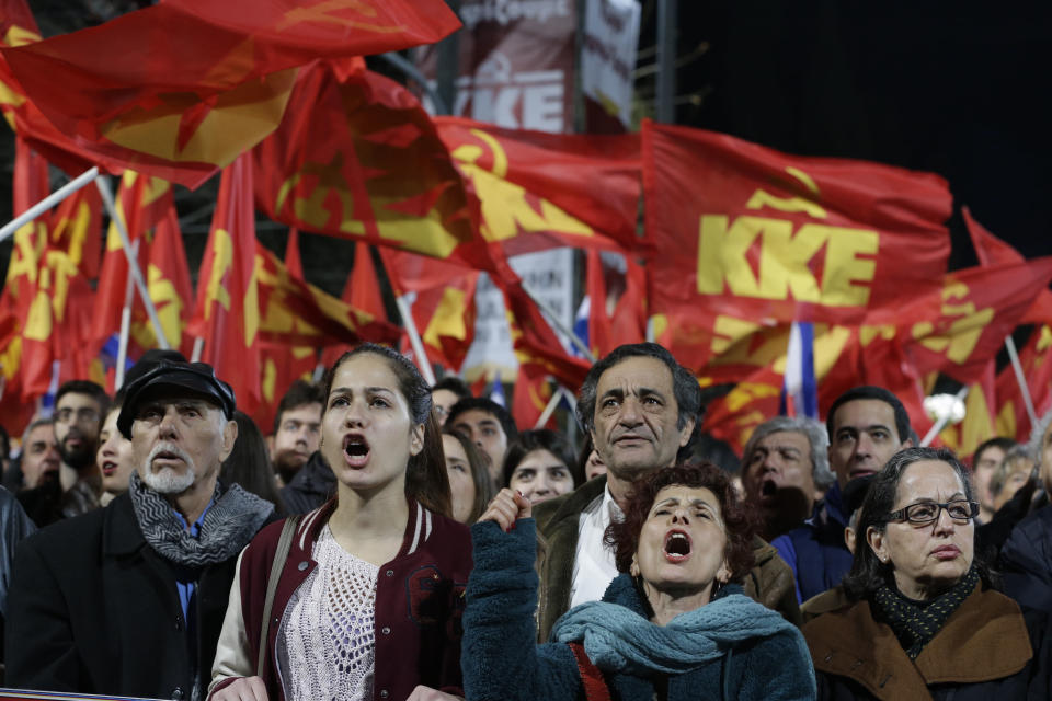 Supporters of Greek Communist Party shout slogans during the speech of leader Dimitris Koutsoumbas at an election rally at Syntagma Square in Athens on Thursday, Jan. 22, 2015. (AP Photo/Thanassis Stavrakis)