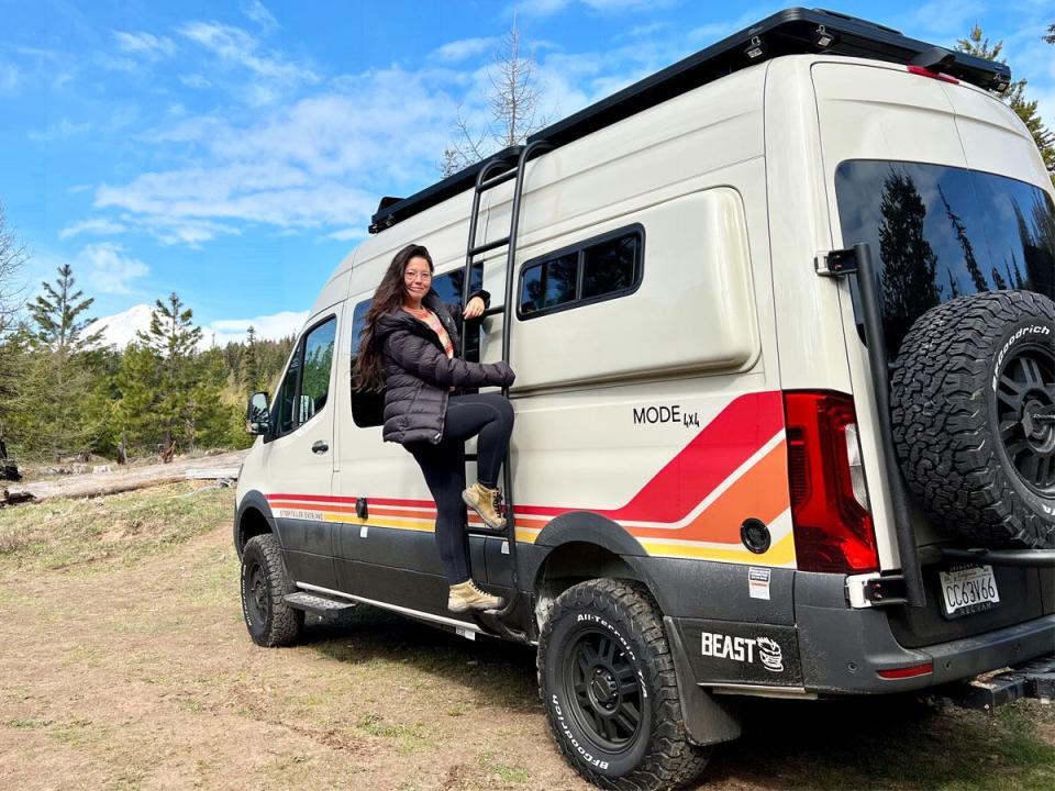 ashley probst climbing on the side of the van