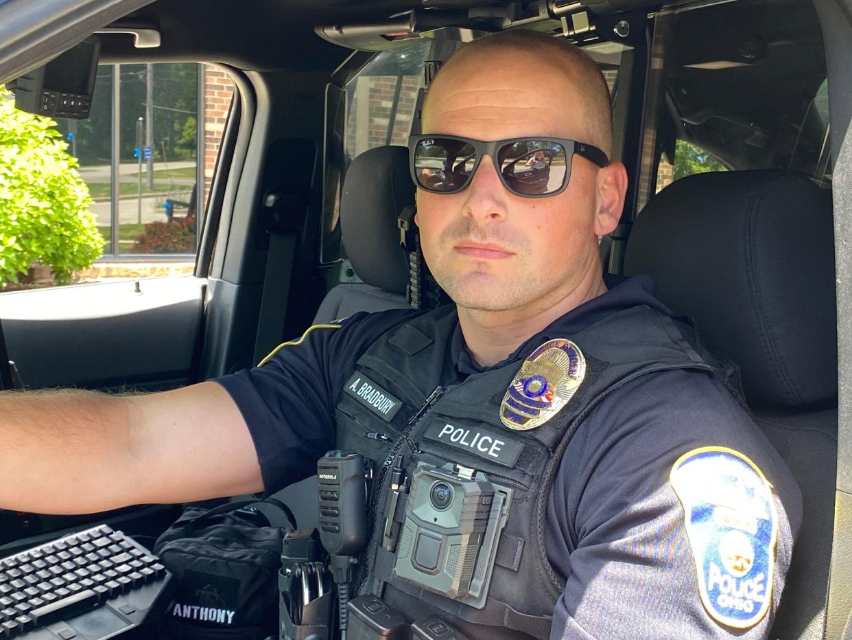 Worthington Division of Police officer Austin Bradbury dons a Motorola WatchGuard body camera on his uniform.