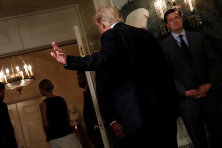 U.S. President Donald Trump waves off reporters' questions as he departs after signing two bills boosting government support for law enforcement first responders, surrounded by law enforcement organization leaders at the White House in Washington, U.S. June 2, 2017. REUTERS/Jonathan Ernst/Files