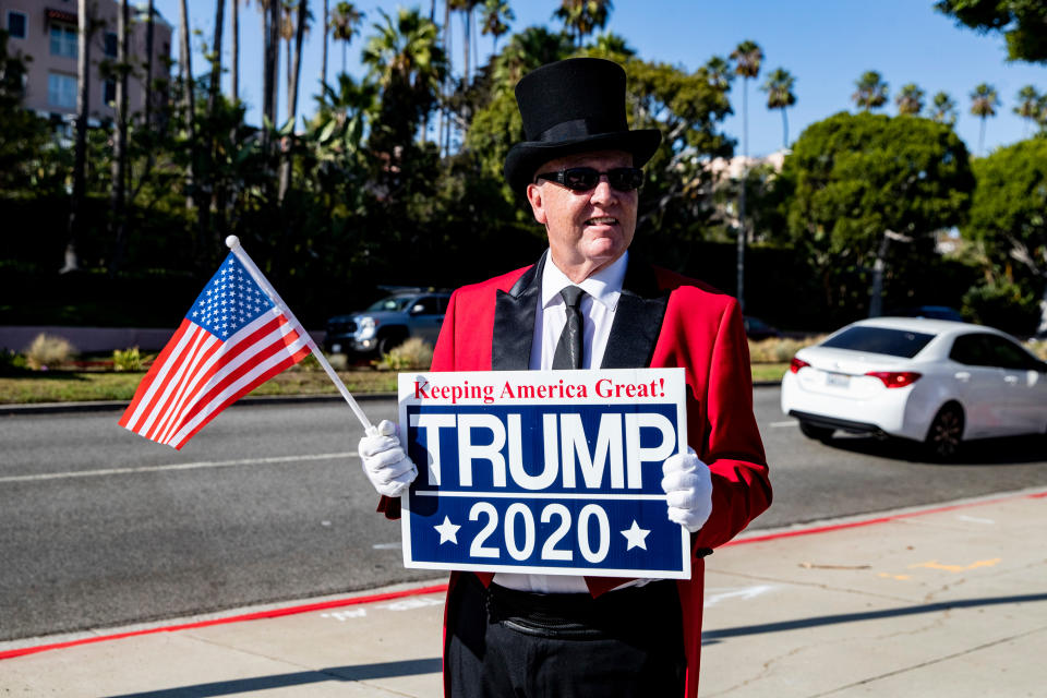 A Trump supporter holds a sign as he waits for the arrival of President Donald Trump in front of the Beverly Hills Hotel in Beverly Hills, Calif. Sept. 17, 2019. Trump is on a two-day trip to California to raise money for his 2020 election campaign. (Photo: Etienne Laurent/Epa-Efe/Shutterstock) 