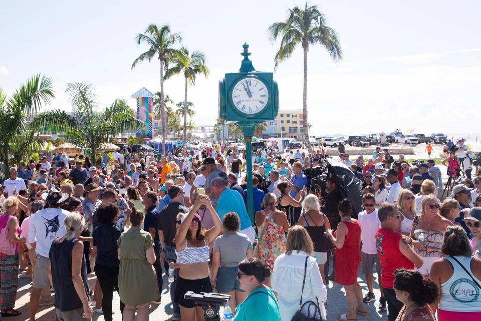 The new clock in Times Square on Fort Myers Beach was unveiled to the delight of onlookers on Thursday, Sept. 28, 2023. The original clock was destroyed in Hurricane Ian. Thursday marked the one year anniversary of the devastating storm.