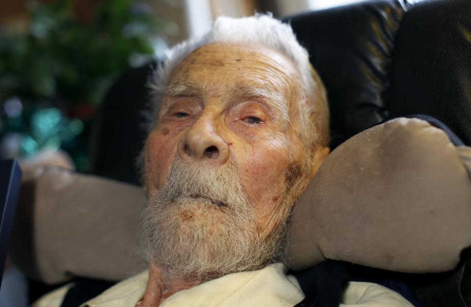 111 year-old Dr. Alexander Imich, the world's oldest living man, poses for a photograph during an interview with Reuters at his home on New York City's upper west side, May 9, 2014. Dr. Imich, who holds a Ph.D. in Zoology, was born in Poland on February 4,1903, fled Poland when the Nazis took over in 1939, survived a slave labor camp in Russia and moved to the United States in 1951 where he became an author on parapsychology. REUTERS/Mike Segar (UNITED STATES - Tags: SOCIETY HEADSHOT)